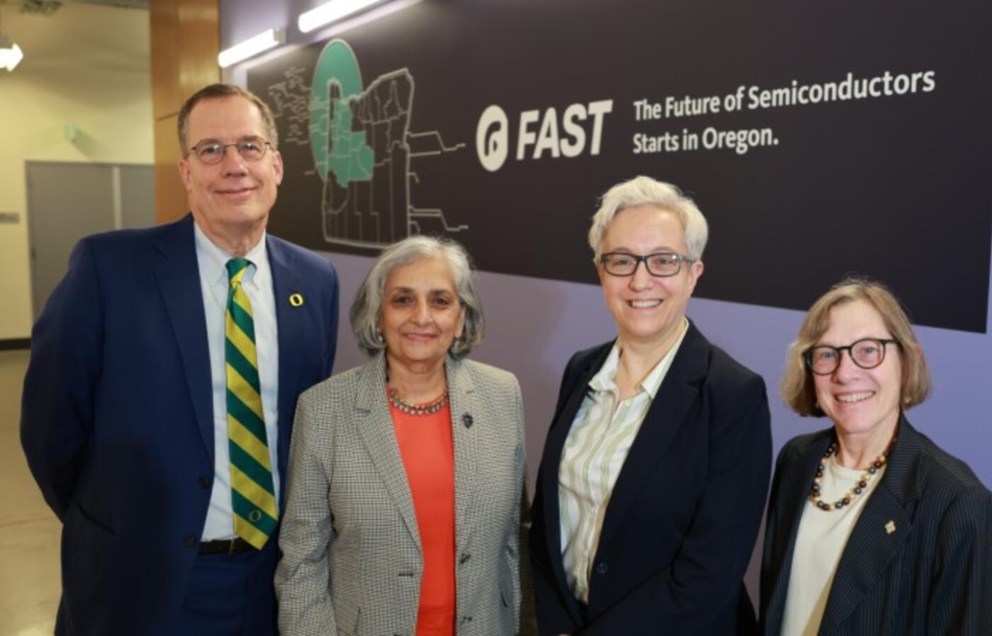 U of O President Karl Scholz, OSU President Jayathi Murthy, Governor Tina Kotek, and PSU President Ann Cudd in front of a FAST decal at ATAMI.