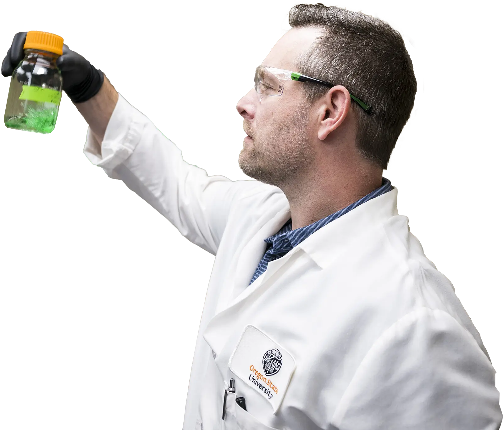 OSU scientist holding up jar